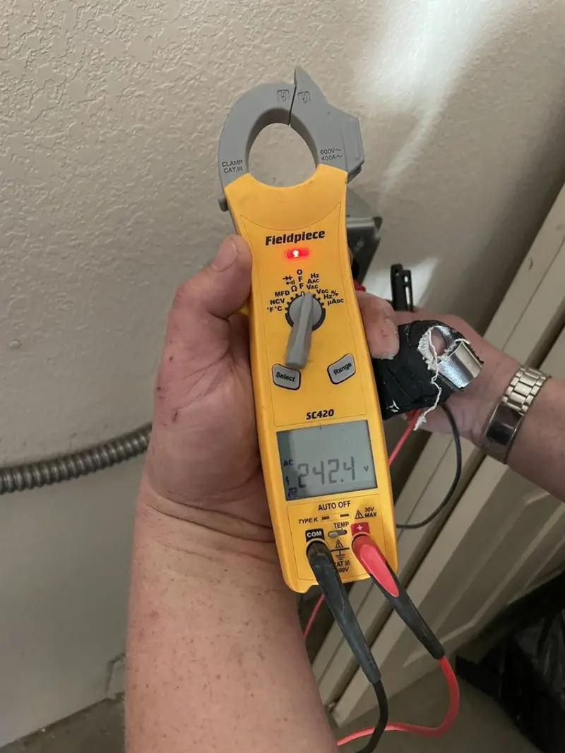 Voltage testing with clamp meter during Ceiling Fan Installation in Wauna